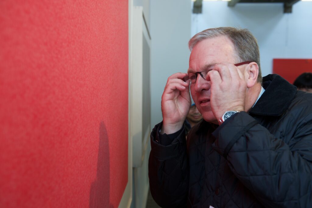 Collector viewing Zhang Yu’s work up close